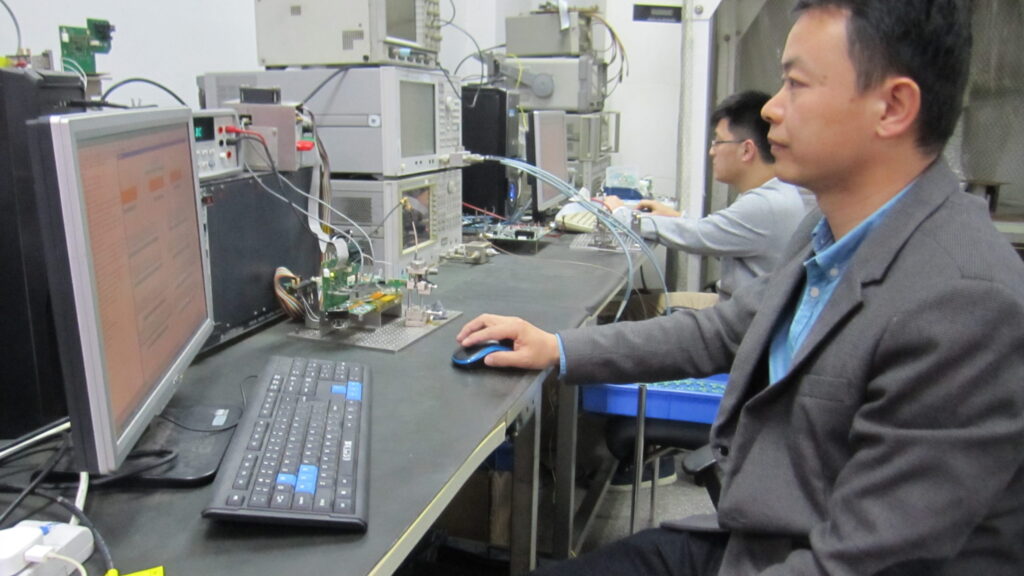 Galaxy Tech lead engineer performing MCU-driven register data verification and diagnostic logic at the Dongguan technical center.