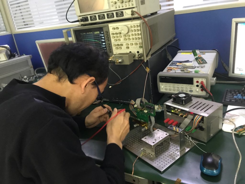 Senior engineer performing Agilent-verified calibration and signal integrity testing at Galaxy Tech's technical hub.