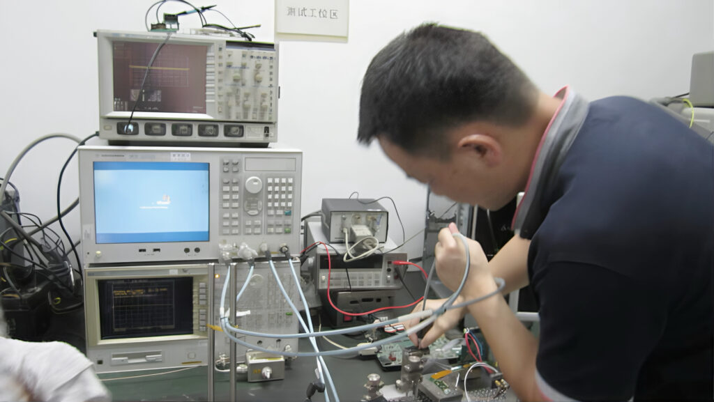 Galaxy Tech engineer verifying high-frequency signal integrity using Agilent digital oscilloscopes for semiconductor test interfaces.